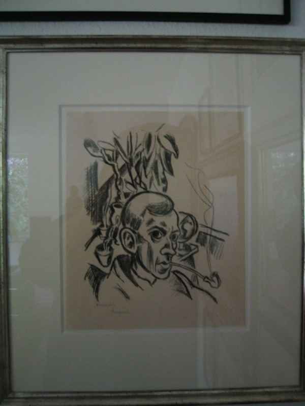 Richard Seewald, Selbstporträt mit Pfeife, 1921. Lithograph: Black-ink head of a man with a pipe and plants on a pale sheet, photographed in a frame.